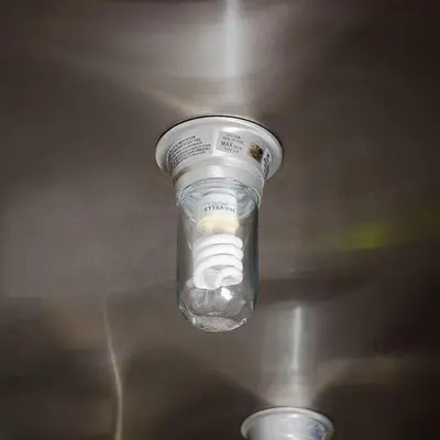 Glass globe for hood light bulb