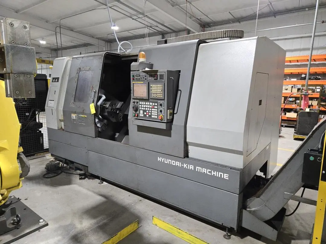 Hyundai SKT-400C F21ITB CNC Lathe w/ Tailstock and Indexer, 10 Slot Turret, LNS Conveyor, 3-Jaw