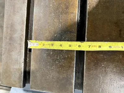 25" WIDE X 89" LONG X 24.5" TALL T-SLOTTED TABLE. STOCK # 0778825