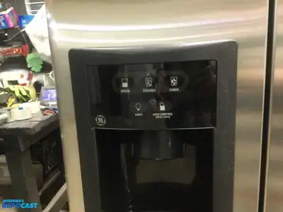 USED GE STAINLESS STEEL AND BLACK SIDE X SIDE REFRIGERATOR HEAVY DUTY ENERGY STAR