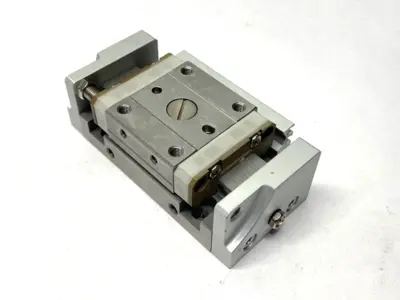 USED SMC PNEUMATIC SLIDE TABLE MISSING SHOCK ABSORBER