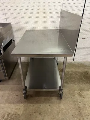 Used Falcon Restaurant Supply Used 48"X30" Stainless Table with 16" Backsplash on Casters - FG Food Prep Tables Illinois US | Falcon Restaurant Supply #1375231