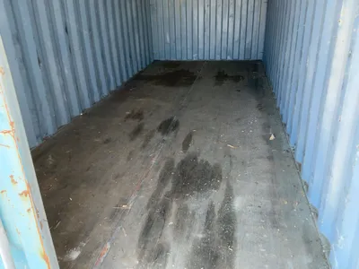 20’ Shipping / Storage Container 8’ wide x 8’ 6” tall, swing doors on one end, wood deck, rings for ...