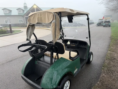 (1) 2015 E-Z-Go golf cart with a Kawasaki gas engine, includes canopy, ball cover, club cover, fold-...