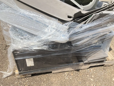 Skid of Kenworth interior parts including dash panels and sleeper cab components, used