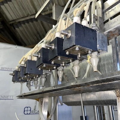 6 Head ELF Filler with feed tanks & container link belt conveyor