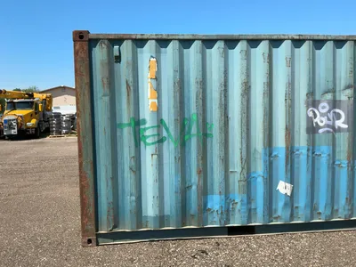 20’ Shipping / Storage Container 8’ wide x 8’ 6” tall, swing doors on one end, wood deck, rings for ...