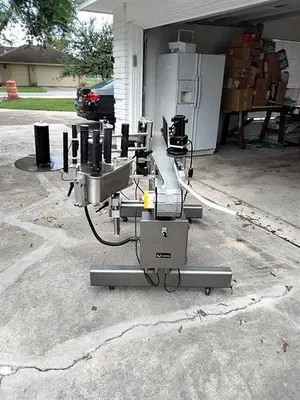 Quadrel model Moduline wraparound pressure sensitive labeler