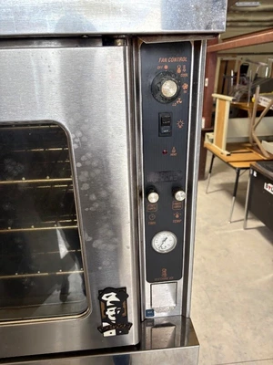 Heavy-duty commercial convection ovens in a stacked configuration