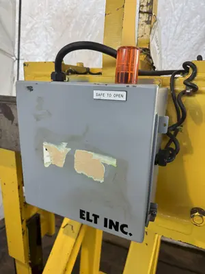 10,000 LBS ADJUSTABLE POWERED COIL GRABBER. STOCK # 0917219