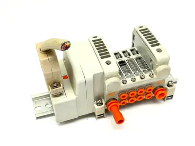 VV5QC11-04N3FD0-S | SMC  Base Mount Plug-In Manifold w/ DIN Rail Brackets - Used