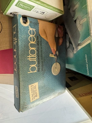 (1) Singer Tiny over edging machine, assorted patterns, and sewing items.