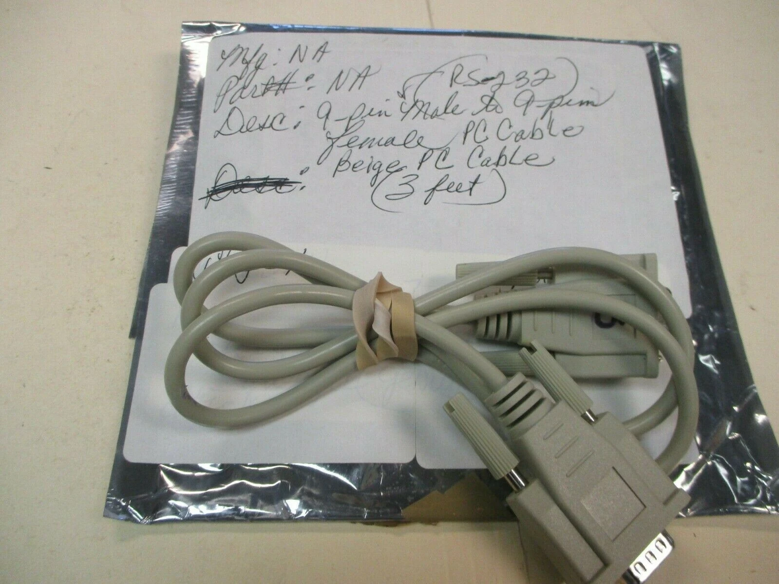 Used RS-232 Beige 9-pin Male to 9-pin Female PC Cable (Approx. 3 feet)