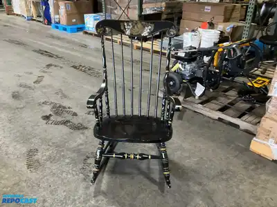 Lot of (2) wooden rocking chairs- brown press back oak rocking chair & black Boston rocker...