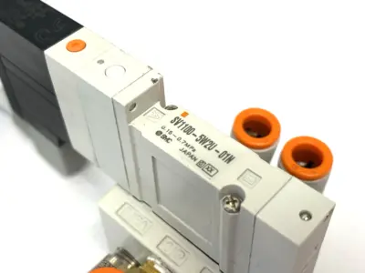 SV1100-5W2U-01N | SMC  5-Port 2-Position Single Solenoid Valve, 1/8" NPT - Used