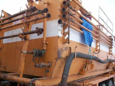 USED 22.5 M3 (140 BBL) SKID MOUNTED 2 COMPARTMENT MUD TANK