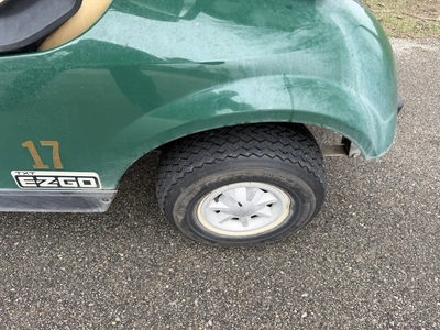 (1) 2015 E-Z-Go golf cart with a Kawasaki gas engine, does not include Club canopy, includes ball wa...