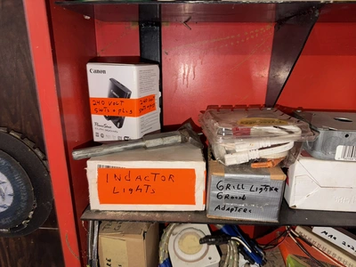 (2) Auto Call single door storage cabinets filled with assorted electrical items, including Push Mat...