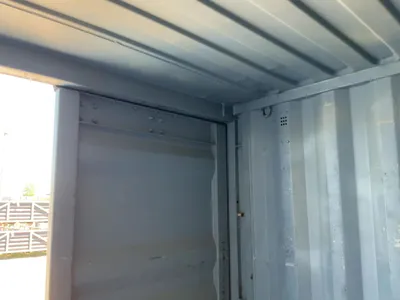 20’ Shipping / Storage Container 8’ wide x 8’ 6” tall, swing doors on one end, wood deck, rings for ...
