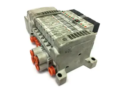 USED SMC PNEUMATIC PLUG IN MANIFOLD W/ VALVES