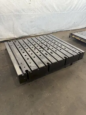 60" WIDE X 67" LONG X 9" THICK T-SLOTTED BOLSTER PLATE. STOCK # 1006324