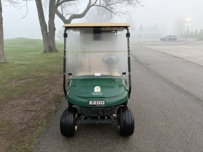 (1) 2015 E-Z-Go golf cart with a Kawasaki gas engine, includes canopy, ball cover, club cover, fold-...