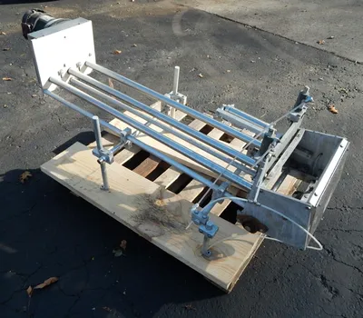 USED LID MAGAZINE PLACER 48 INCH LONG
