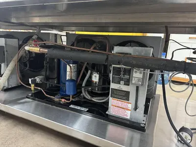 USED 2016 LESLIE FISHER ENGINEERING INC. STAINLESS STEEL CHILLER TABLE