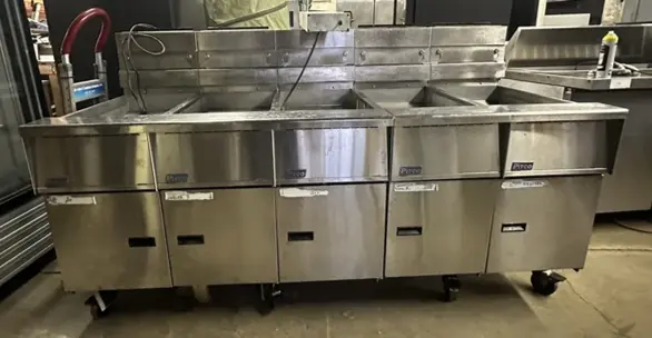 174-0002 Pitco SSH55 and SSHBN55 Battery of 4 Fryers with Middle Dump Station an