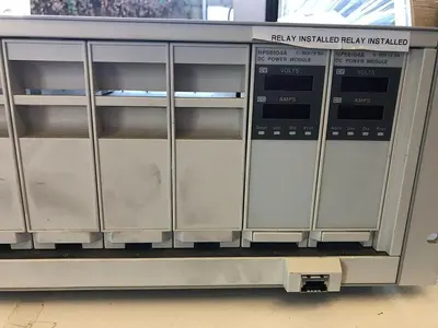 HEWLETT PACKARD 66000A MAIN FRAME WITH HP66105A, HP66101A, 2) HP66104A, 4) 16A