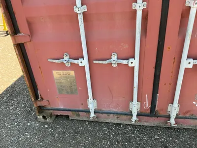 20’ Shipping / Storage Container 8’ wide x 8’ 6” tall, swing doors on one end, wood deck, rings for ...