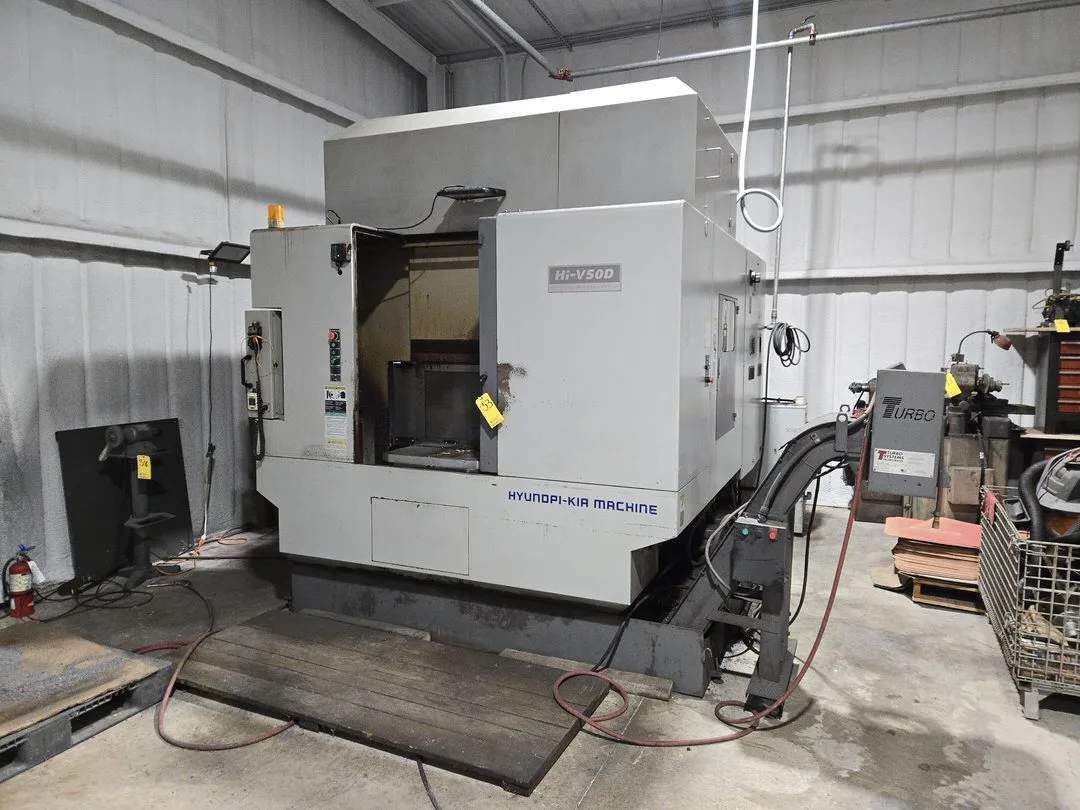 Hyundai HI-V50D VMC w/ 30-Slot ATC, Conveyor, (2) Kurt Vise, Fanuc Oi-MC Controller