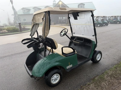 (1) 2015 E-Z-Go golf cart with a Kawasaki gas engine, includes canopy, ball cover, club cover, fold-...
