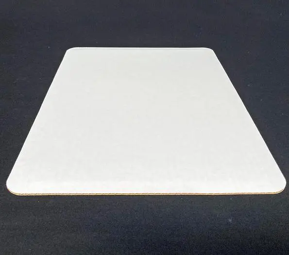 New, in-the-box -- Commercial Packaging ½-sheet pad, white coated