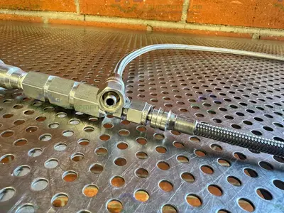 Used SWAGELOK SS-4CP4-10 CHECK VALVE W/ 42" STAINLESS STEEL BRAIDED HOSE 3/4" TO 1/2" Hoses California US | Equipment Lab #1427415