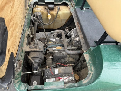 (1) 2015 E-Z-Go golf cart with a Kawasaki gas engine, does not include Club canopy, includes ball wa...