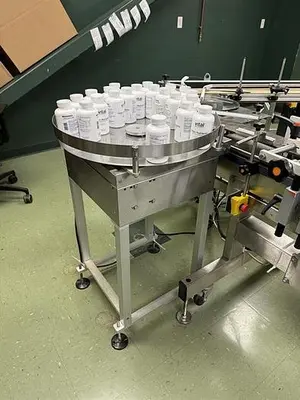 Quadrel model Q110 pressure sensitive wraparound labeler