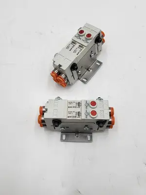 USED SMC SMC CORPORATION VQ1000-FPG-N7N7-F PERFECT CHECK TWO BLOCKS MERGED & MOUNTED ON BRACKET