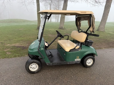 (1) 2015 E-Z-Go golf cart with a Kawasaki gas engine, includes canopy, ball cover, club cover, fold-...
