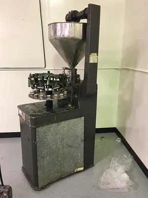 Kalix model KX-60 16-Station Tube filler and sealer