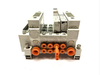 USED SMC PLUG-IN MANIFOLD BASE 4-STATION
