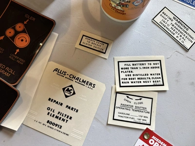 (1) Assorted Allis-Chalmers items including cups, stickers