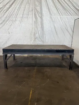 50" X 124" DRILLED & TAPPED STEEL LAYOUT TABLE W/ STAND. STOCK # 0667025.