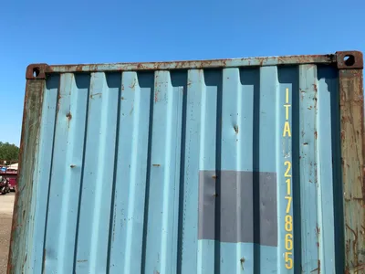 20’ Shipping / Storage Container 8’ wide x 8’ 6” tall, swing doors on one end, wood deck, rings for ...