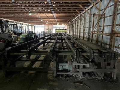 6 strand, 120' green chain with incoming deck and hoist. 24 heavy duty carts