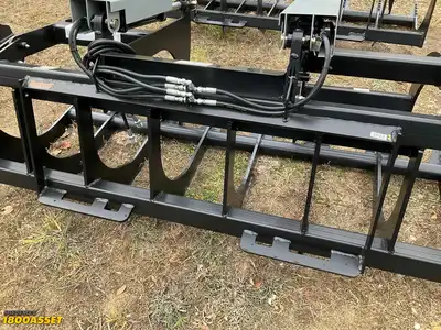 New Tomahawk 72” brush grapple attachment, two hydraulic grapple arms, skid steer quick attach