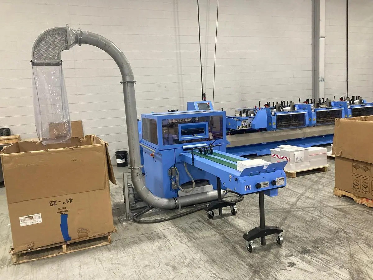 USED SADDLE STITCHER TRIM WASTE REMOVAL SYSTEM