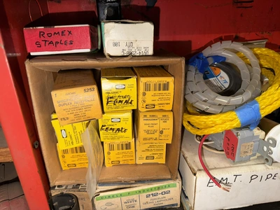 (2) Auto Call single door storage cabinets filled with assorted electrical items, including Push Mat...