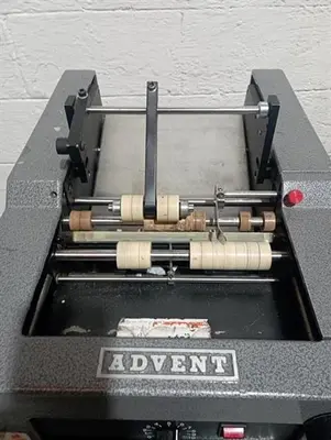 Advent model 310 semi-automatic pressure sensitive wraparound labeler
