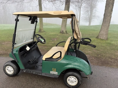 (1) 2017 E-Z-Go golf cart with a Kawasaki gas engine, model 625111G01, includes canopy, ball cover, ...